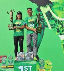 Mary Joy Tabal and Rafael Poliquit hoist their trophies after ruling the 39th National MILO Marathon National Finals in Pampanga on Sunday. CONTRIBUTED PHOTO