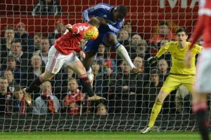 AERIAL ATTACK  Manchester United’s English striker Wayne Rooney (left) attacks a cross defended by Chelsea’s French defender Kurt Zouma (second left) during the English Premier League football match between Manchester United and Chelsea at Old Trafford in Manchester, north west England, on Tuesday. AFP PHOTO