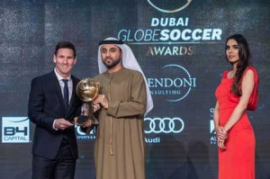 Barcelona striker Lionel Messi (left) receiving the trophy for best player of the year during the Dubai Globe Soccer award at the end of the Dubai International Sports Conference on Monday in the United Arab Emirate of Dubai. AFP PHOT