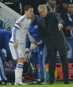 Chelsea’s Portuguese manager Jose Mourinho (right) speaks to Chelsea’s Belgian midfielder Eden Hazard as he is helped off the pitch during the English Premier League football match between Leicester City and Chelsea at the King Power Stadium in Leicester, central England on Tuesday. AFP PHOTO