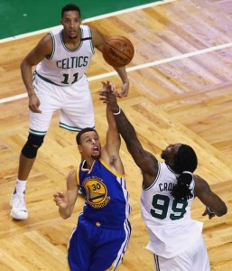 Jae Crowder No.99 of the Boston Celtics blocks a shot by Stephen Curry No.30 of the Golden State Warriors during double overtime at TD Garden on Friday in Boston, Massachusetts. AFP PHOTO