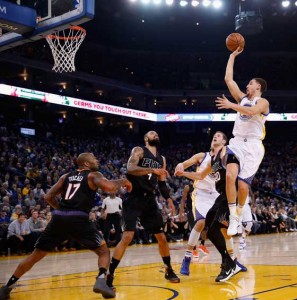 Klay Thompson No.11 of the Golden State Warriors shoots the ball during their game against the Phoenix Suns atORACLE Arena on Thursday in Oakland, California. AFP PHOTO