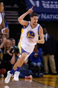 Klay Thompson No.11 of the Golden State Warriors reacts after he made a basket against the Milwaukee Bucks at ORACLE Arena on Saturday in Oakland, California. AFP PHOTO