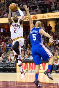 Kyrie Irving No.2 of the Cleveland Cavaliers shoots over Kendall Marshall No.5 of the Philadelphia 76ers during the second half at Quicken Loans Arena on Monday in Cleveland, Ohio. AFP PHOTO