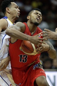 Maverick Ahanmisi of Rain or Shine challenges the defence of Jayson Castro of Talk N' Text during a PBA Philippine Cup game at the Mall of Asia Arena in Pasay City on Monday. PHOTO BY CZEAZAR DANCEL