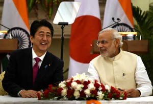 India’s Prime Minister Narendra Modi (R) shares a light moment with Japan’s Prime Minister Shinzo Abe (L) before the signing of agreements at Hyderabad House in New Delhi. AFP PHOTO