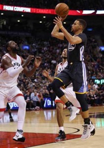 Stephen Curry No. 30 of the Golden State Warriors shoots the ball over Patrick Patterson No. 54 of the Toronto Raptors during an NBA game at the Air Canada Center in Toronto, Ontario, Canada. AFP PHOTO