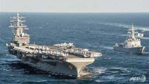 US WARSHIP TARGETED BY CHINA SUB The aircraft carrier USS RonaldReagan, seen here in maneuvers with a South Korean naval vessel, was targeted in a simulated missile attack by aChinese submarine as the Reagan was sailing near Japan in October, a report this week revealed.  AFP PHOTO