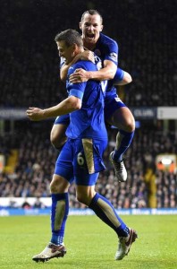 Leicester City’s German defender Robert Huth celebrates with Leicester City’s English midfielder Danny Drinkwater (up) after scoring the only goal of the English Premier League football match between Tottenham Hotspur and Leicester City at White Hart Lane in north London on Thursday. AFP PHOTO