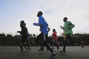 Kenyan national athletes run past during their training session on Tuesday, at Iten, in the Rift Valley north of Nairobi. On Friday, The World Anti-Doping Agency’s (WADA) independent commission will publish the second part of its report into allegations of widespread doping in athletics, centered on Kenya. AFP PHOTO