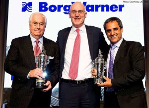 THE WINNERS Indianapolis 500 Champion Juan Pablo Montoya and team owner Roger Penske receive their Baby Borg trophies during the annual Automotive News World Congress. indycar.com