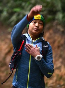 Nepalese athlete Mira Rai stretches before a training session on the hills surrounding Kathmandu. As a child soldier with Nepal’s Maoists, Mira Rai learned to fire guns, disarm opponents and race down trails, little imagining her guerrilla drills would help make her one of the world’s top ultra runners. AFP PHOTO