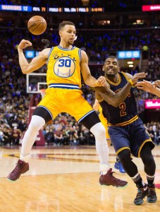 Stephen Curry No.30 of the Golden State Warriors passes behind his back while under pressure from Kyrie Irving No.2 of the Cleveland Cavaliers during the first half at Quicken Loans Arena on Tuesday in Cleveland, Ohio. AFP photo 