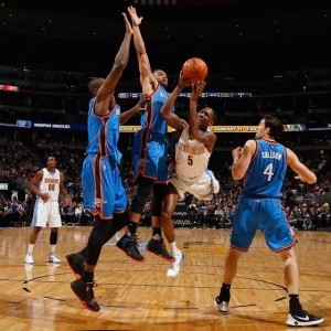 Will Barton No.5 of the Denver Nuggets tries to get off a shot against the defense of Kevin Durant No.35, Russell Westbrook No.0 and Nick Collison No.4 of the Oklahoma City Thunder at Pepsi Center on Wednesday in Denver, Colorado. AFP PHOTO