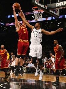 Kevin Love No.0 of the Cleveland Cavaliers and Thaddeus Young No.30 of the Brooklyn Nets jump for a rebound during their game at the Barclays Center on Thursday in New York City. AFP PHOTO 