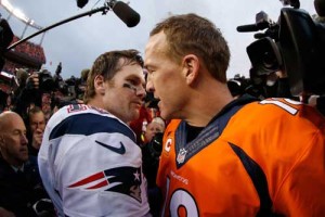 Peyton Manning No.18 of the Denver Broncos and Tom Brady No.12 of the New England Patriots speak after the AFC Championship game at Sports Authority Field at Mile High Monday in Denver, Colorado. AFP PHOTO