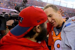 Peyton Manning No.18 of the Denver Broncos speaks to offensive coordinator Matt Patricia of the New England Patriots after the Broncos defeated the Patriots 20-18 in the AFC Championship game at Sports Authority Field at Mile High on January 24, 2016 in Denver, Colorado. AFP PHOTO