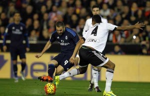 Real Madrid’s French forward Karim Benzema (left) kicks the ball during the Spanish league football match Valencia CF vs Real Madrid CF at the Mestalla stadium in Valencia on Monday. AFP PHOTO