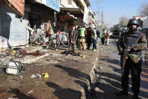 A Pakistani paramilitary soldier stands at the site of a bomb blast near a polio vaccination centre in Quetta on January 13, 2016. At least 15 people were killed in a blast apparently targeting police outside a polio vaccination centre in the southwestern Pakistani city of Quetta on January 13, according to officials. AFP PHOTO