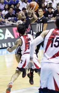 GOING FULL THROTTLE Calvin Abueva of Alaska crashes against the defense ofRonald Tubid of San Miguel Beer in Game 6 of the best-of-seven- finals of the PBA Philippine at the SmartAraneta Coliseum in Quezon City on Friday.  PHOTO BY CZEASAR DANCEL