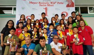 Philippine Swimming League President Susan Papa and Secretary General Maria Susan Benasa with the Most Outstanding Swimmer awardees. CONTRIBUTED PHOTO