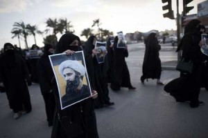 ANTI-EXECUTION PROTEST Bahraini women hold posters bearing portraits of prominent Shiite Muslim cleric Nimr al-Nimr during a protest against his execution by Saudi authorities, in the village of Jidhafs, west of the capital Manama on January 3. Iraq’s top Shiite leaders condemned Saudi Arabia’s execution of Nimr, warning ahead of protests that the killing was an injustice that could have serious consequences. AFP PHOTO
