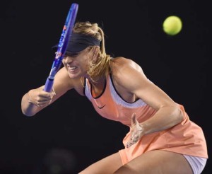 Russia’s Maria Sharapova plays a forehand return during her women’s singles match against Lauren Davis of the US on day five of the 2016 Australian Open tennis tournament in Melbourne on Friday. AFP PHOTO 