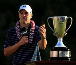 Jordan Spieth celebrates with the trophy after winning the final round of the Hyundai Tournament of Champions at the Plantation Course at Kapalua Golf Club Monday in Lahaina, Hawaii. AFP PHOTO