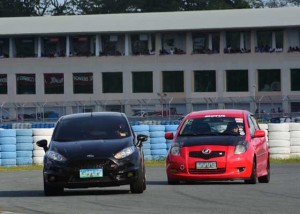 The Red Toyota Yaris of Venet Felisco keeps pace to win the Economy Division of the 2016 Touge Battle race series. CONTRIBUTED PHOTO
