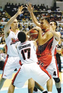 Sonny Thoss, Chris Exciminiano and Vic Manuel of Alaska gang up on Yancy De Ocampo of San Miguel Beer in Game 1 of the best-of-seven finals of the PBA Philippine Cup at Araneta Coliseum on Sunday. PHOTO BY RUSSELL PALMA