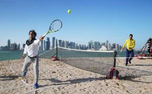 Spain’s Rafael Nadal (left) and Serbia’s Novak Djokovic playing tennis on a beach in Doha. Nadal and Djokovic in Qatar to compete in the ATP Qatar Open starting on Monday. AFP PHOTO