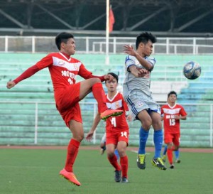 San Beda College’s Aljo Zabala clears the ball from an attack from an Arellano University defender in the second round of the National Collegiate Athletic Association football tournament at the Rizal Memorial Football Stadium. CONTRIBUTED PHOTO