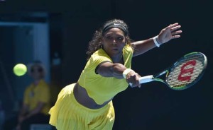 Serena Williams of the US plays a backhand return during her women’s singles match against Italy’s Camila Giorgi on day one of the 2016 Australian Open tennis tournament in Melbourne on Monday. AFP PHOTO 