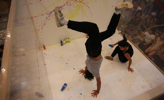  Henri Lamy, a French painter, and Maia d’aboville dance while painting during their exhibit and workshop held at the Museo  Pambata in Manila. Photo by ruSSell PAlmA