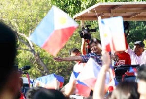 Touring the north Senator Ferdinand “Bongbong” Marcos waves to his supporters as his caravan arrives in Caba, La Union.  Photo by Czeasar Dancel