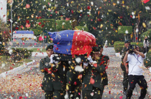 BURYING A HERO Confetti rain as soldiers carry the remains of former President Elpidio Quirino that were interred on Monday at the Libingan ng mga Bayani. The former leader was previously buried at the Makati South Cemetery. PHOTO BY CESAR DANCEL