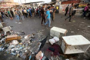 BAGHDAD TRAGEDYIraqis inspect the damage at the site of a bombing claimed by the Islamic State (IS) group near a market in the Sadr City area of northern Baghdad on Feb. 28. IS also attacked an army position west of Baghdad, temporarily holding it and killing at least eight security personnel over the course of the day. The two blasts near a market in the Sadr City, at least one of which was a suicide bombing, also wounded at least 64 people, security and medical officials said. AFP PHOTO