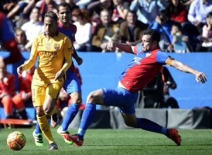 Barcelona’s Brazilian forward Neymar (left) vies with Levante’s defender David Navarro during the Spanish league football match Levante UD vs FC Barcelona at the Ciutat de Valencia stadium in Valencia on Monday. AFP PHOTO