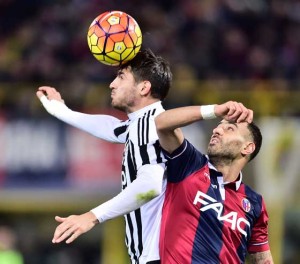 HEAD SHOT  Bologna’s defender from Italy Domenico Maietta (right) fights for the ball with Juventus’ forward from Spain Alvaro Morata during the Italian Serie A football match Bologna vs Juventus at “Renato Dall’Ara” Stadium in Bologna on Saturday. AFP PHOTO