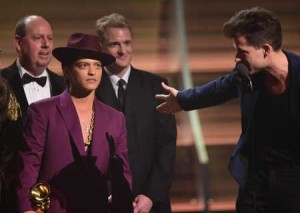 Songwriter Mark Ronson and singer Bruno Mars receive the Record of the Year award for ‘Uptown Funk’