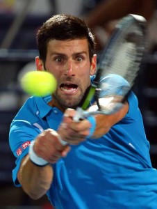 Serbian Novak Djokovic returns the ball to Spanish Tommy Robredo during their ATP tennis match on the first round of the Dubai Duty Free Tennis Championships on Tuesday. AFP PHOTO