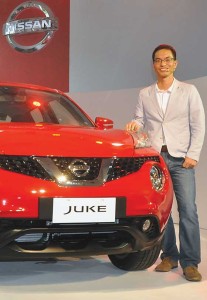 Sj Huh stands beside the Nissan Juke during its launch late last year.