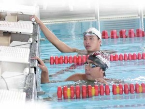 University of Santo Tomas’ Jux Keaton Solita (top) and University of the Philippines Integrated School’s Drew Benett Magbag receive instructions from Philippine Swimming League President Susan Papa during training at the St. Mary’s International School in Tokyo, Japan. CONTRIBUTED PHOTO 