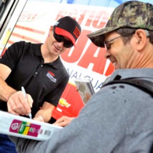 Recently retired NASCAR driver Jeff Gordon, shown here signing an autograph for a fan, is looking forward to working as a commentator for the race series with Fox Sports. NASCAR.COM 