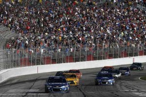 Jimmie Johnson, driver of the No. 48 Chevrolet, takes the checkered flag to win the NASCAR Sprint Cup Series Folds of Honor QuikTrip 500 at Atlanta Motor Speedway on Monday in Hampton, Georgia. AFP PHOTO