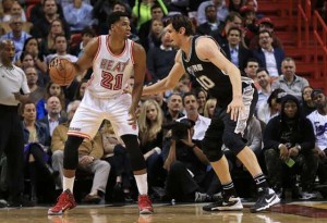 Hassan Whiteside No.21 of the Miami Heat posts up Boban Marjanovic No.40 of the San Antonio Spurs during a game at American Airlines Arena on Wednesday in Miami, Florida. AFP PHOTO