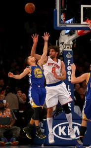 Stephen Curry No.30 of the Golden State Warriors and Robin Lopez No.8 of the New York Knicks fight for the rebound at Madison Square Garden on Monday in New York City. AFP PHOT