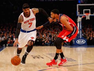Carmelo Anthony No.7 of the New York Knicks drives against Garrett Temple No.17 of the Washington Wizards during their game at Madison Square Garden on Wednesday in New York City. AFP PHOTO