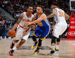 Jeff Teague No.0 of the Atlanta Hawks drives against Stephen Curry No.30 of the Golden State Warriors at Philips Arena on Tuesday in Atlanta, Georgia. AFP PHOTO 
