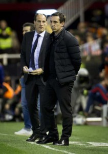 Valencia’s British coach Gary Neville (right) and delegate Valencia’s delegate Salvador González Marco look-on during the Spanish Copa del Rey (King’s Cup) football match Valencia CF vs FC Barcelona at Mestalla stadium in Valencia on Thursday. AFP PHOTO 